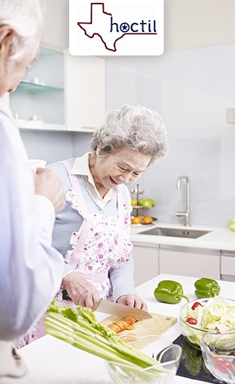elderly couple cooking at home